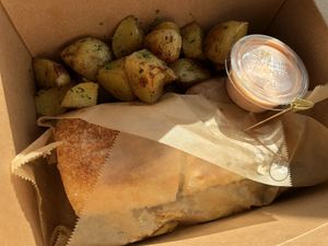 Pastrami panini with roasted potatoes and thousand island dressing  at Pulse Cafe in Hadley