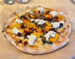 Vegan butternut squash pizza with almond ricotta  at True Food Kitchen in Denver