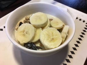 Granola with banana and soy milk. at Curio Espresso and Vintage Design in Kanazawa