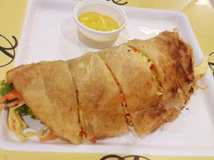 Prata lookalike w salad sandwiched. Cha bun.. think thats e name. Refreshing at Talalask in Bangkok