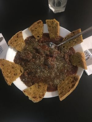 Vegan sausage & black bean stew with turmeric bread    at Vegan Yes in East London