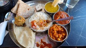 This is the Thali for 1 at £9.99. Includes a small sweet, but make sure you tell them you're vegan.  You can choose 2 mains from the specials and the rest is set. at Mithaas in Leicester