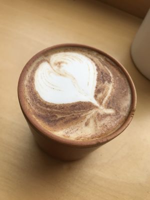 Latte with homemade almond drink at Ela Canela in Lisbon