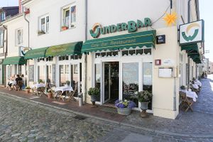 Main entrance and outdoor seating at WunderBar in Guestrow