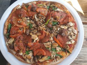 Al Matricana pizza (salami, olives, mushroom, spinach) $26 +vegan tax at Versachi Pizza and Wine Bar in South Yarra