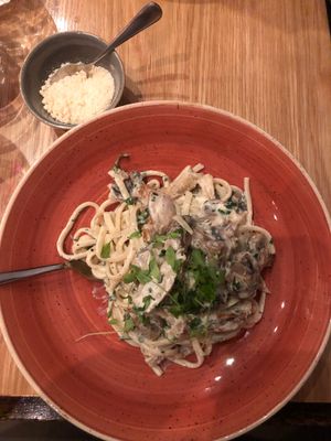 Cream and mushroom pasta with Parmesan  at Versachi Pizza and Wine Bar in South Yarra