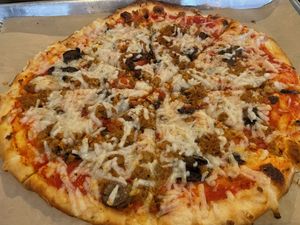 vegan sausage + cheese, mushroom pizza  at Need Pizza in Cedar Rapids