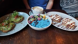 Avocado kale toast, Aloha Bowl, Choco banana toast, almond milk latte. at Beetnut in Zurich
