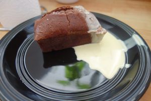 Raspberry chocolate cake with vanilla sauce at Hoppipolla Yoga Cafe in Lund