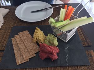 A selection of homemade beetroot, avocado and mixed bean hummus  at Raizes in Quarteira