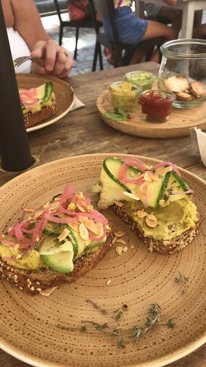 Hummus on rustic bread with courgette, onion and almonds. at Nude Cafe in Ibiza