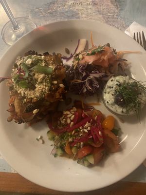 Lasagna with amazing side salads and tzatziki   at Atlas Bar in Copenhagen