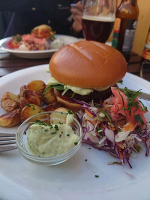 Atlas burger served with roasted potatoes, herb mayo and råkost at Atlas Bar in Copenhagen