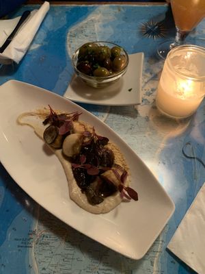 King oyster mushrooms 🍄‍🟫 and olives 🫒   at Atlas Bar in Copenhagen