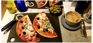 Two vegan/gluten-free pizzas to share + soy latte & fantastic olives! at Pizza Express - Oxford St in Manchester