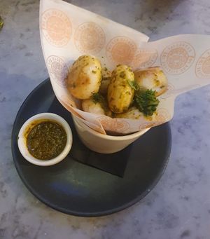 (Starter) Chimichurri Dough Balls: Fluffy Dough Balls tossed in a zingy, herby Chimichurri sauce made with parsley, garlic, olive oil and a pinch of chilli - with extra sauce for d at Pizza Express - Trafford Centre in Manchester