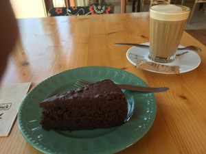Chocolate cake and galao with oat milk  at Gaia Loja Restaurante in Rogil