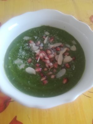 Green soup fruit and veggies with pomegranate & coconut flakes  at Gaia Loja Restaurante in Rogil