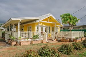Exterior of the newly renovated 1937 farmhouse at OurPlace in Kapaa