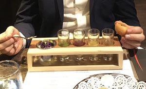 Purple potato stuffing with mint, pineapple, pomegranate, and tamarind sauce shots at Navadhanya in Cambridge