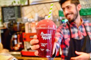 Ginger and Mint Team Member Ahmet, serving up smoothies and juices at Ginger & Mint in North London
