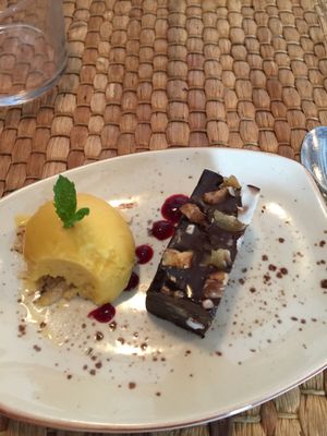 decadent vegan brownie with mango ice cream ?  at Duke Restaurant in Mallorca