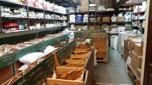 Back of the store full of different flours, grains, cocoa, chocolates  at Casa Perris in Barcelona