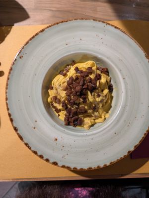 TAGLIATELLE WITH HEMP RICOTTA, CARROT CREAM AND CRISPY SEITAN at Soul Kitchen in Genoa