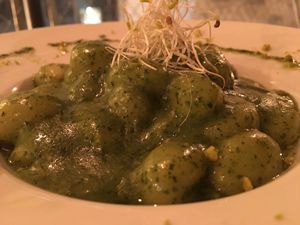 Potato gnocchi & basil pesto  at Om in Girona