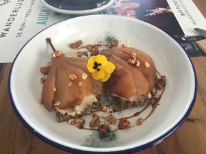 Poached pear, miso tahini cashew cream, walnut, maple syrup. at The Midnight Baker in Auckland