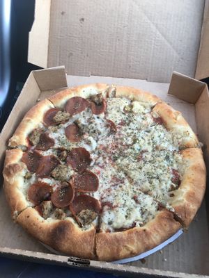 Pan pizza with sausage pepperoni and jalapenos at The Chicago House of Za in Chicago