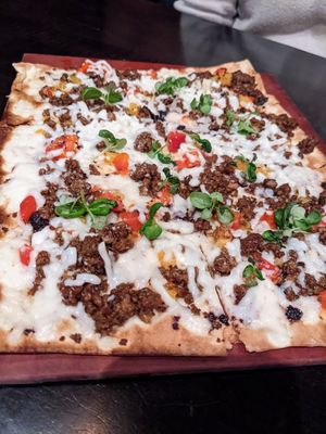 Impossible chorizo flatbread w/ vegan mozzarella at Harvest Seasonal Grill & Wine Bar in Moosic