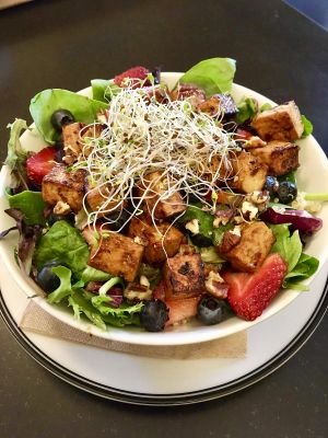Mixed Greens & Berries with Quinoa and Tofu. at Farm Fresh Cafe in Brunswick