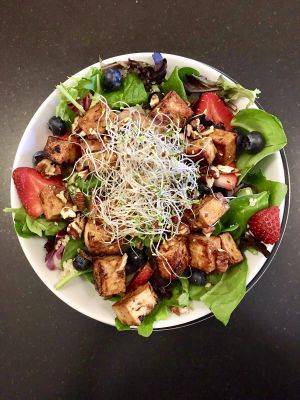 Mixed Greens & Berries with Quinoa and Tofu. at Farm Fresh Cafe in Brunswick