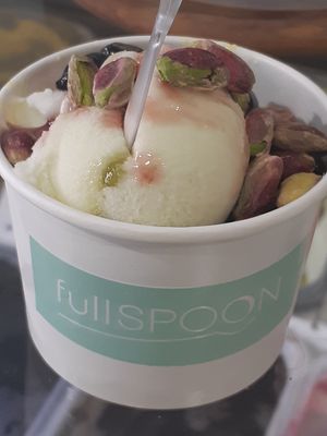Lime sorbet and coconut ginger ice cream topped with black cherries and pistachios at Full Spoon in Athens