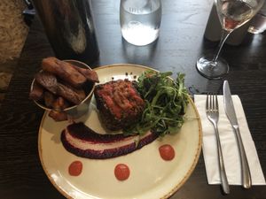 Lentils and nut loaf with salad and fried potatos, only €13,90, super well served and delicious! at Petronella in Kilkenny