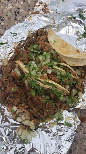 Soy beef tacos with cilantro and onions  at Totopos Mexican Restaurant in Naperville