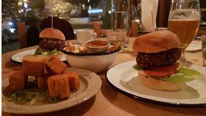 Veggie burger ( can be made vegan ) chickpea tofu and a portion of our own frites and homemade sauces (all vegan) at Le Bec Jaune in Morzine