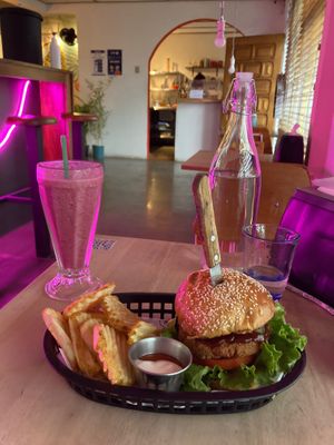 Burger with potato wedges and a smoothie at Huacamole Vegan Food in San Pedro