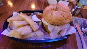 Onion Burger with a fried Yuka as a side at Huacamole Vegan Food in San Pedro