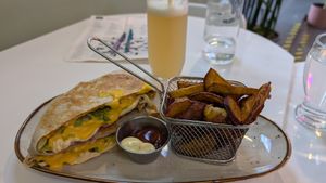 Crunchwrap Supreme, sweet potato fries, Ginger drink at Huacamole Vegan Food in San Pedro