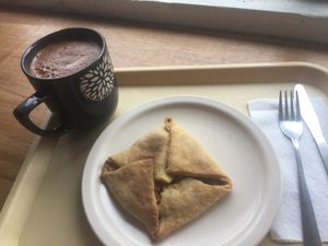 empanada de zanahoria y papas con un cacao caliente at Huacamole Vegan Food in San Pedro