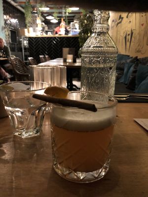 Seasonal cocktail: hot apple juice, cinnamon, rum and orange wedge at Mr. & Mrs. Watson in Amsterdam
