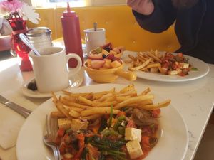 Delicious vegan tofu scramble with fries and fruit salad at Liz's Cafe Anybody's Bar in Provincetown