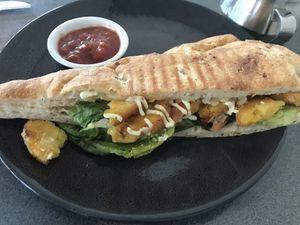 Vegan corn fritters sandwich  at Strata Cafe - The University of Auckland  in Auckland