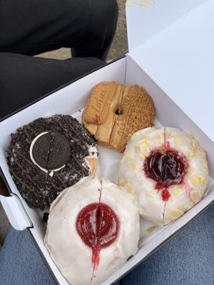 (top left) oreo cheesecake (top right) biscoff (bottom left) glazed jam (bottom right) cherry bakewell  at Doughnotts in Nottingham