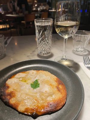 Vegan cheese garlic bread and large glass of wine  at Pizza Express - St Paul's Place in Sheffield