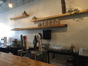 Behind their bar (they serve alcohol and have kombucha on tap)  at Die Pie in Edmonton