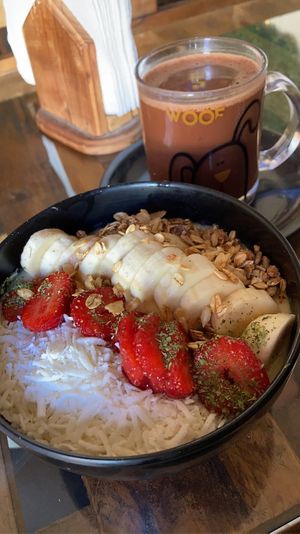 Breakfast bowl and chocolate with water  at Bek Semilla de Vida in San Cristobal De Las Casas