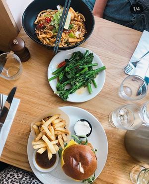 Burger and noodles for mains with broccoli on the side  at Mildreds - Dalston in East London